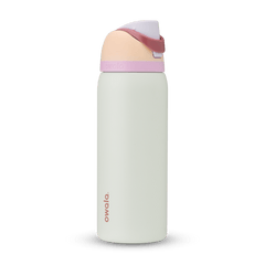 FreeSip 32oz water bottle, off-white body with blush peach lid base and soft pink carry loop